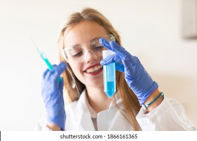 young student learning a scientific trial in a laboratory - Shutterstock ID 1866161365