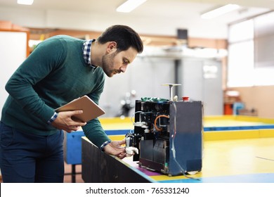 Young Student Of Mechatronics Working On Project