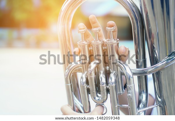 Young student Musician playing the\
Euphonium with Music practice of Band, Musical\
concept