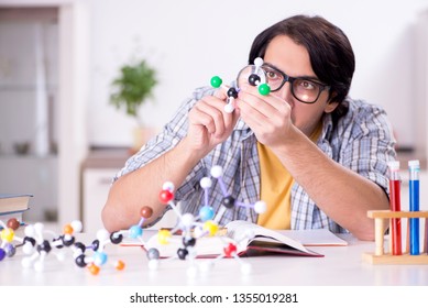 Young Student Physicist Preparing For Exam At Home    