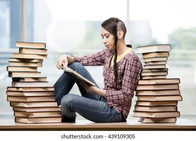 Young student with stack of books