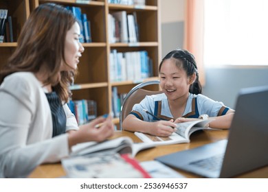 A young student studies with a private tutor in home office setting, focusing on personalized learning and academic development. - Powered by Shutterstock