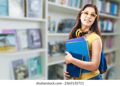 Young student study in library or book mall. - Shutterstock ID 2365135711