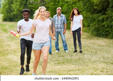 Young student team in relay race at a sports festival or teambuilding workshop - Shutterstock ID 1440961091