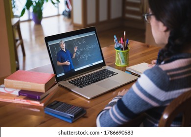 Young Student Watching Online Lesson With Math Teacher. Online Education And E-learning. Studying From Home In Times Of Coronavirus Pandemic