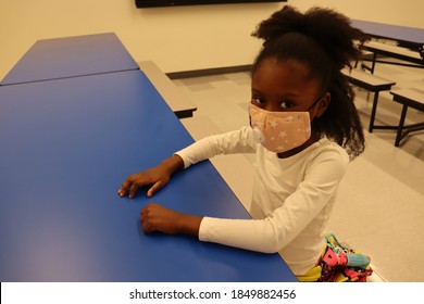 Young Student Wearing Mask Sitting At School Cafeteria Table