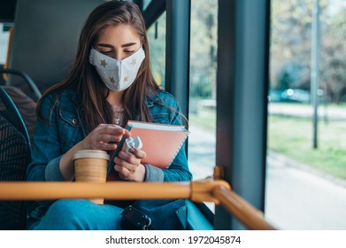 Young Student Wearing Protective Mask And Riding A Bus On Her Way To The Lecture At The Faculty