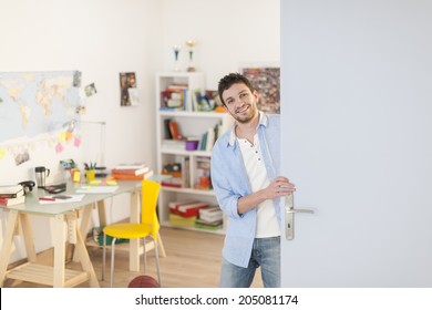 Young Student Welcoming Us Into His Apartment