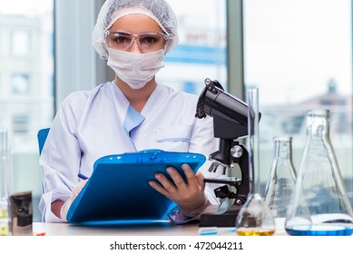 Young student working with chemical solutions in lab - Shutterstock ID 472044211