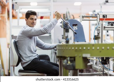 Young Student Working On A Science Project On A Machine