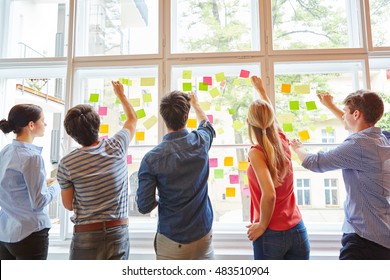 Young Students At Brainstorming Seminar With Colorful Sticky Notes