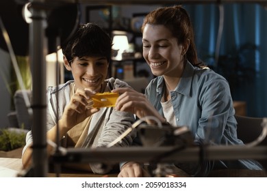 Young Students Learning 3D Printing At Home, They Are Holding A Plastic Component