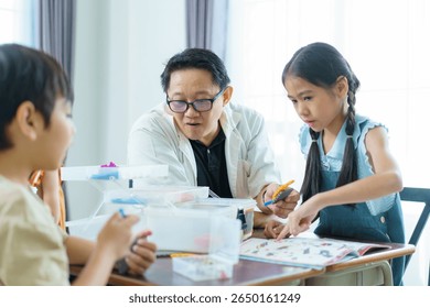 Young students learning in science class room. Group of diverse children are enjoy learning in STEM classroom. STEM stand for science, technology, engineering, and mathematics.