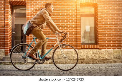 Young Stylish Businessman Go To Work On His Sport Retro Bike In Sunny Day.