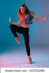 Young Stylish Girl Dancing Zumba In The Studio On A Colored Neon Background. Dance Poster Design.