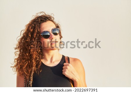 Similar – Brunette surfer woman in bikini standing with surfboard