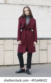 Young Stylish Woman In Classic Red Trench Coat, Melange Blouse And Black Shoes - Street Fashion