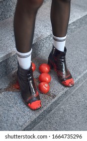 Young Stylish Woman Wearing Hills And Socks Walking Down The Stairs Outdoors Urban Background Stepping On Tomatoes Feet Close-up Top View