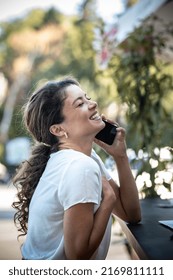 Young And Succesful Woman Talking And Smiling On Phone