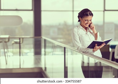 Young Successful Business Woman Speaking On A Mobile Phone