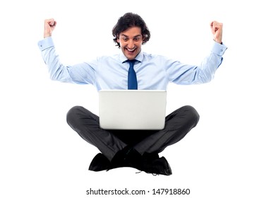 Young successful businessman with laptop