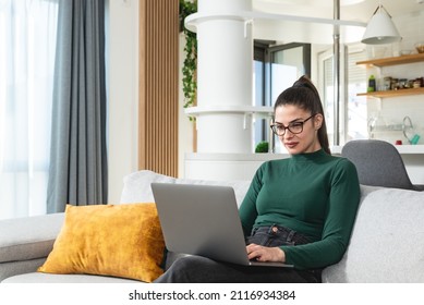 Young Successful Graphic Designer Woman Sitting At Home Working As Freelancer Online Marketing Web Developer. Female Entrepreneur Work On Website Design For Online Education And Advertisement.