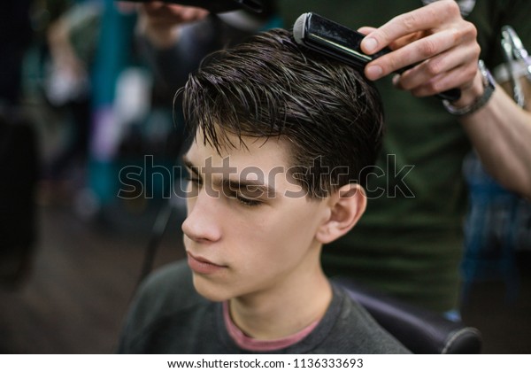Young Successful Hairdresser Making Attractive Mans