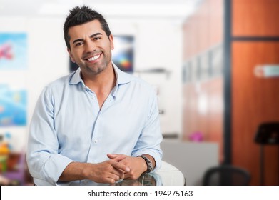 Young successful man at office