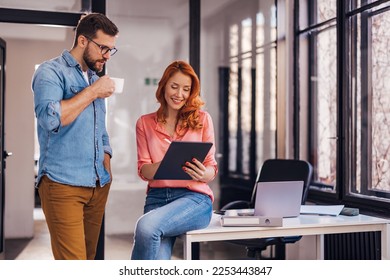 young successful people sharing ideas over coffee in the office - Powered by Shutterstock