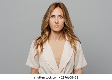Young successful serious confident businesswoman caucasian woman 30s she wearing pastel clothes looking camera isolated on plain grey color background studio portrait. People profession career concept - Shutterstock ID 2196608431
