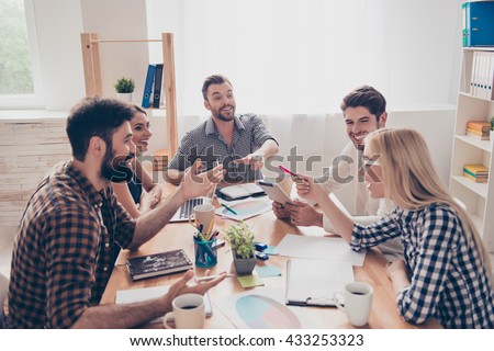 Young successful team at a meeting make a business plan