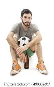 Young supporter man with ball and beer bottle watching football game, look disappointed. - Shutterstock ID 430032607