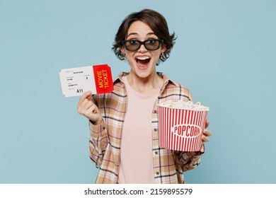 Young Surprised Amazed Shocked Woman In 3d Glasses Watch Movie Film Hold Bucket Of Popcorn Ticket Isolated On Pastel Plain Light Blue Background Studio. People Emotions In Cinema Lifestyle Concept.