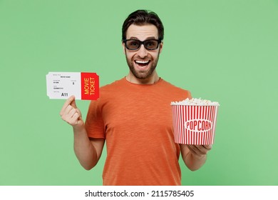 Young Surprised Shocked Smiling Fun Man In 3d Glasses Watch Movie Film Hold Bucket Of Popcorn Hold Ticket Isolated On Plain Pastel Green Background Studio People Emotions In Cinema Lifestyle Concept