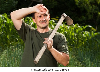 Young Sweating Farmer After A Day Of Work