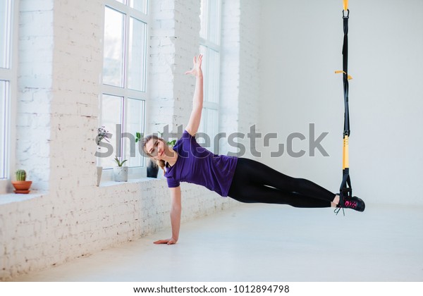Young Sweden Woman Training Suspension Trainer Royalty Free