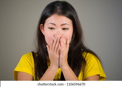 Young Sweet And Beautiful Asian Korean Woman Gesturing Shocked And Surprised As If Oh My God What A Disaster In Astonished Face Expression On Isolated Background In Surprise Emotion