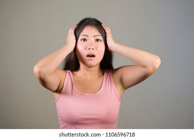 Young Sweet And Beautiful Asian Korean Woman Gesturing Shocked And Surprised As If Oh My God What A Disaster In Astonished Face Expression On Isolated Background In Surprise Emotion