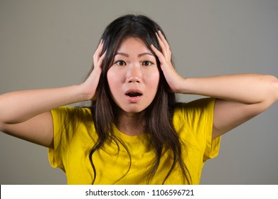 Young Sweet And Beautiful Asian Korean Woman Gesturing Shocked And Surprised As If Oh My God What A Disaster In Astonished Face Expression On Isolated Background In Surprise Emotion