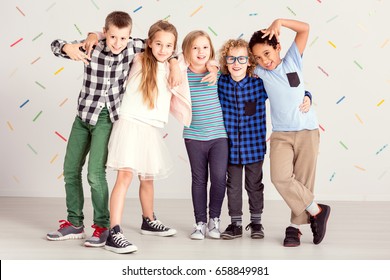 Young sweet children standing together in line