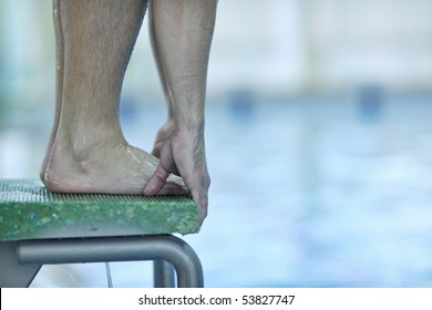 Young Swimmer On Swim Start At Swimming Pool Ready For Jump Race And Win