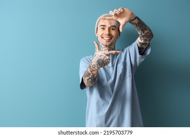 Young tattooed man on blue background - Shutterstock ID 2195703779