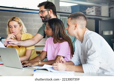 Young teacher helping teenager students at College, learning technology and science in preparatory course for university - Powered by Shutterstock