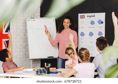 Young Teacher Learning Kids Basic Words In English