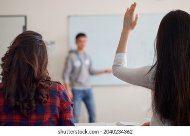 Young Teacher Preparing Students For Standardized Test Using Pen And A Notebook, Preparation For SAT, Preparation For ACT, CLT, Preparation For Math Exam, Standardized Test Preparation