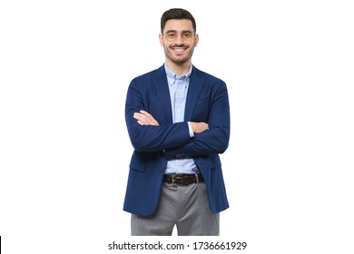 Young teacher wearing blue blazer, casual shirt and trousers, holding arms crossed, looking at camera with confident happy smile, isolated on white background