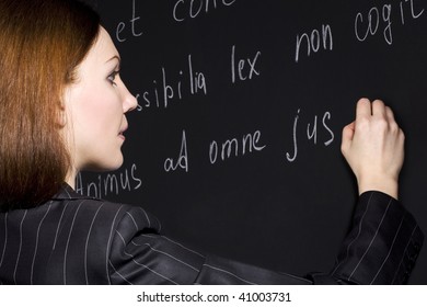 Young Teacher Writing Legal Proverbs In Latin Language