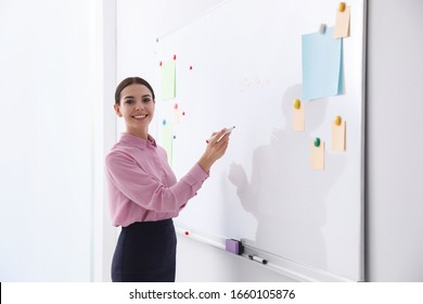 Young Teacher Cleaning Whiteboard Modern Classroom Stock Photo ...