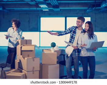 young team of business people in group, architect and engineer on construction site checking documents and business workflow using laptop computer in new startup office - Shutterstock ID 1300449178