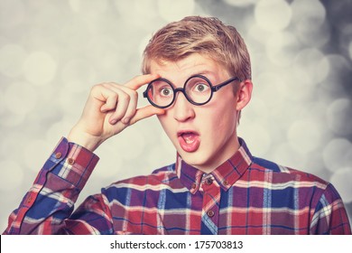 Young Teen Boy In Nerd Glasses. Photo With Bokeh At Background.